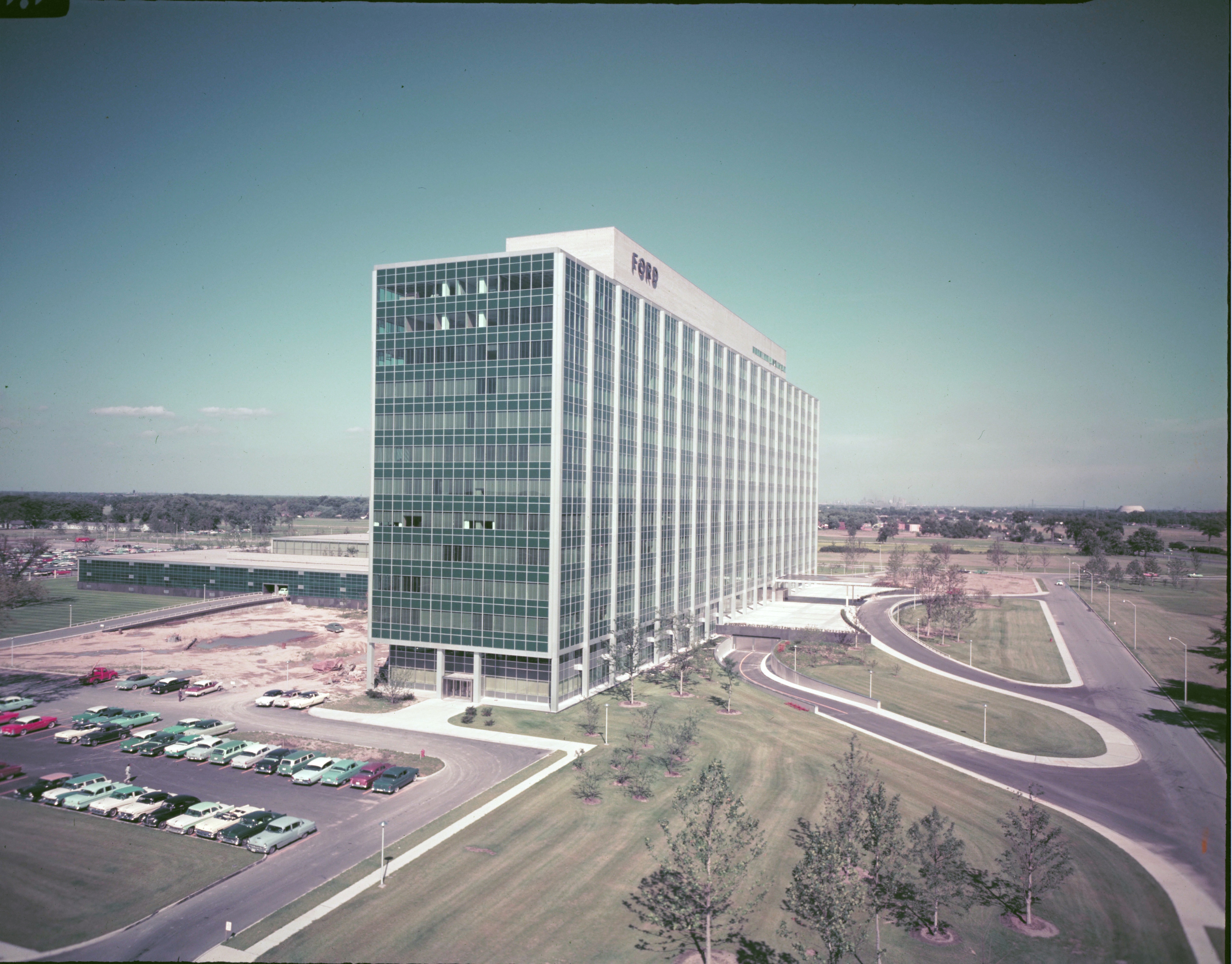 A tall building with no others around it. The building has many windows.
